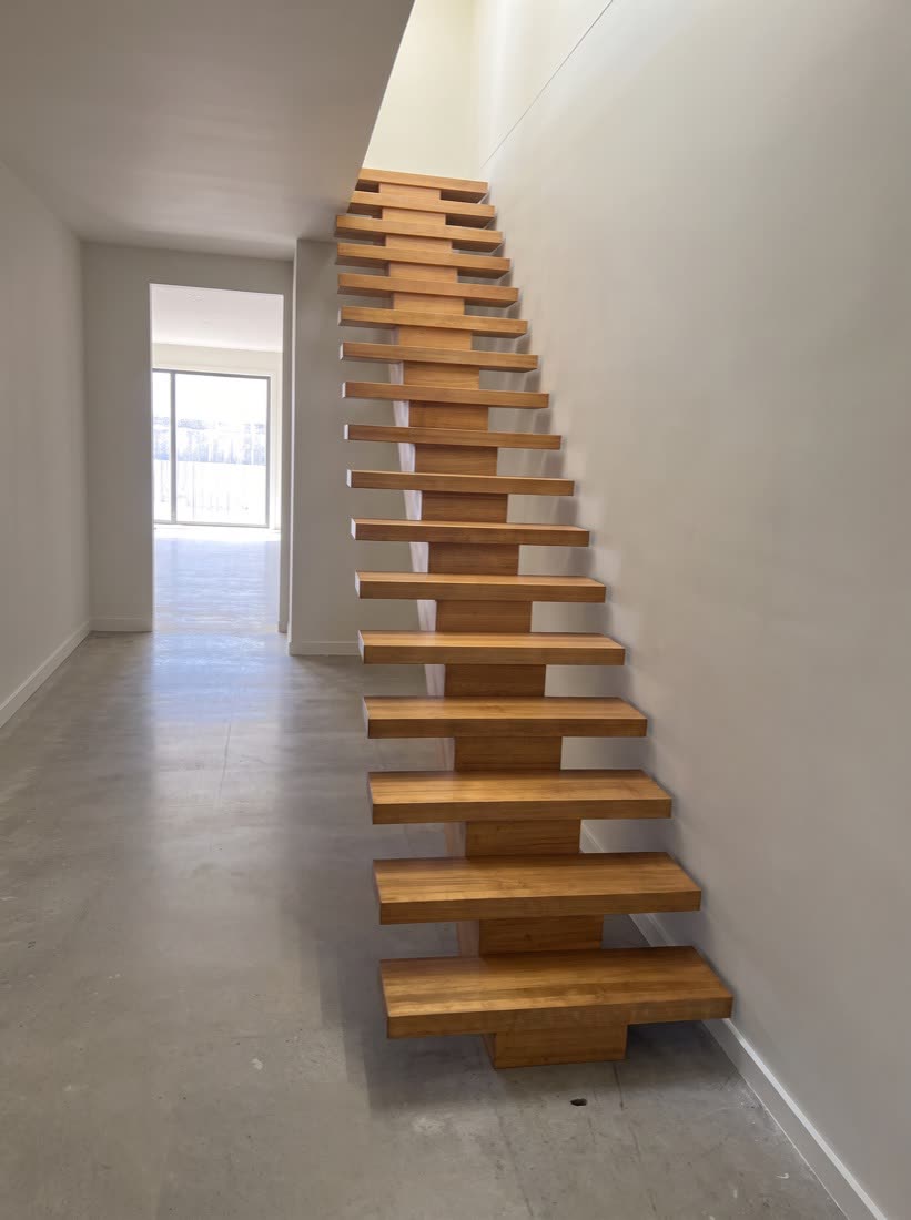 A spine staircase with treads cantilevered off a single central beam